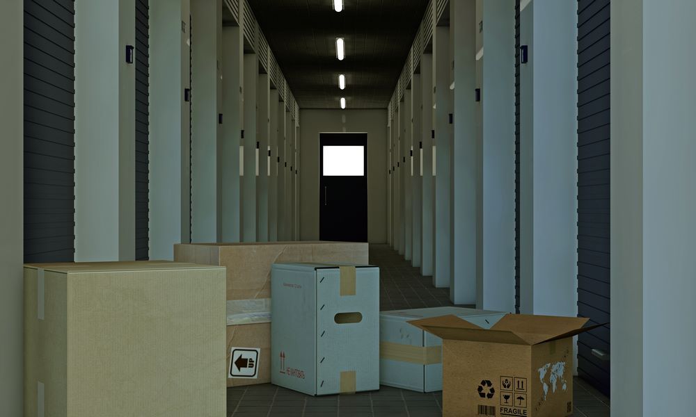 A Hallway Filled With Cardboard Boxes in a Storage Unit — AKM Self Storage In Rothbury, NSW