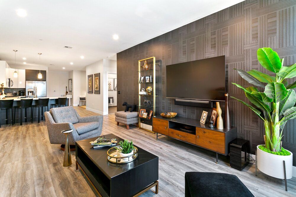 A living room filled with furniture and a flat screen tv.