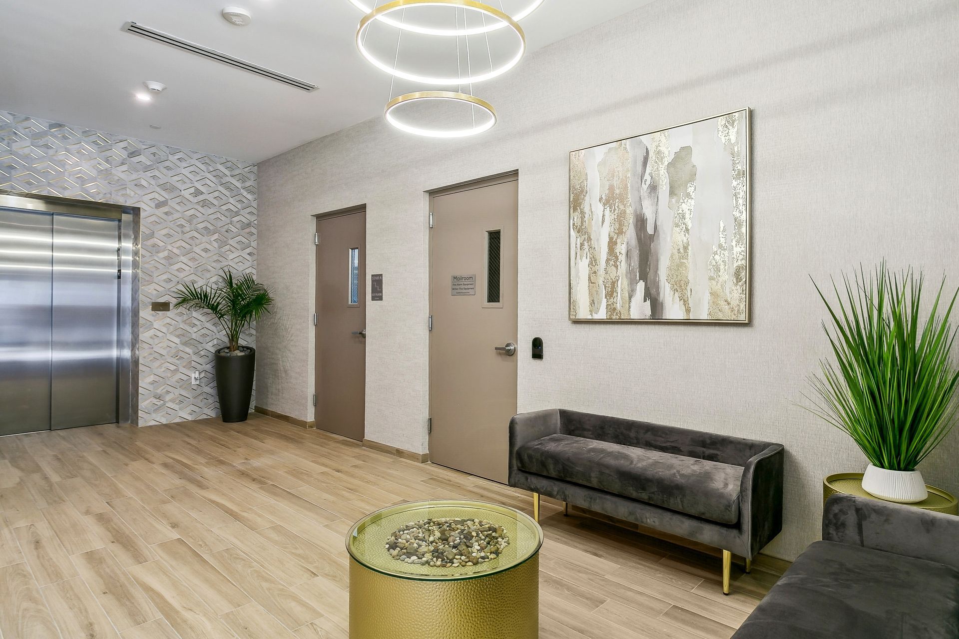 A living room with a couch , table , and elevator.