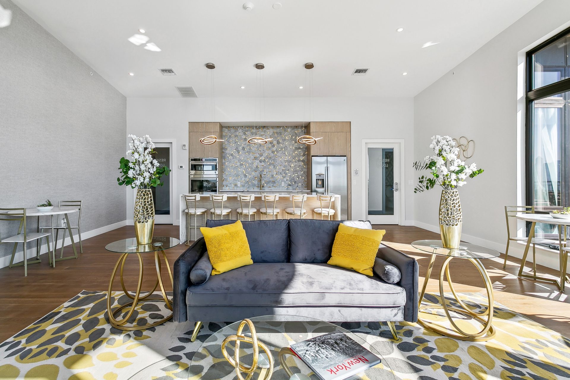 A living room with a couch , coffee table , and rug.