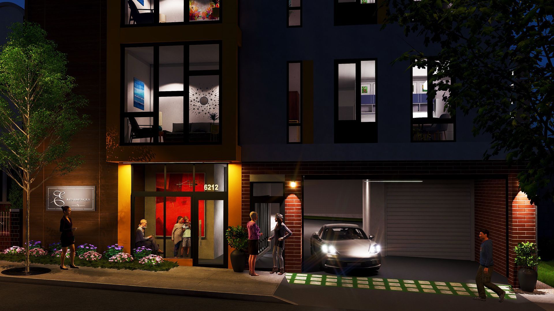 A car is parked in front of a building at night