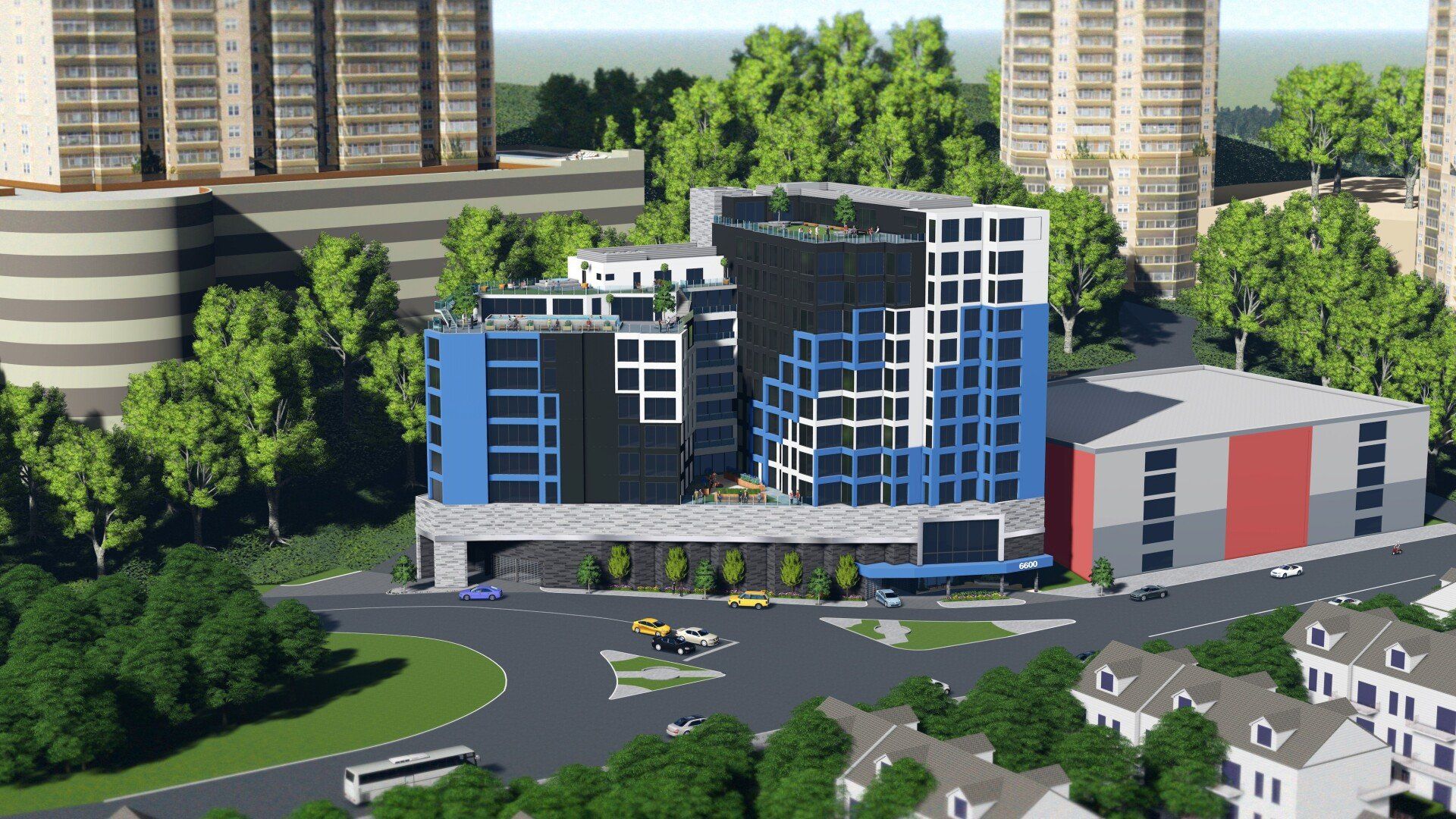 An aerial view of a large building in a city surrounded by trees.