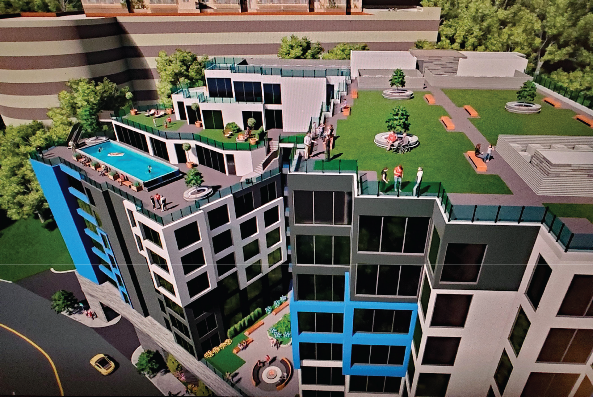 An aerial view of a building with a pool on the roof