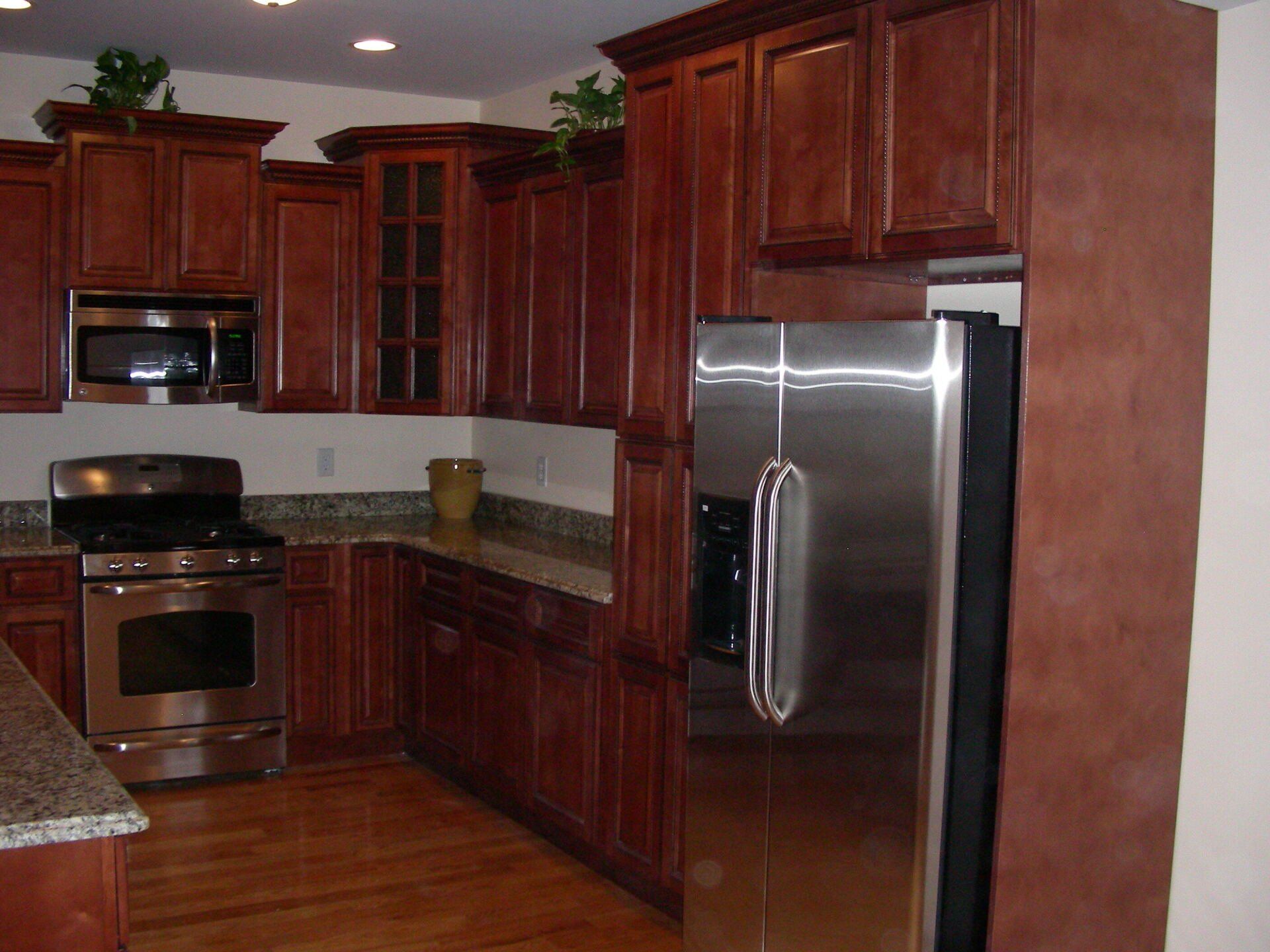 photo of kitchen with beautiful brown cabinetry