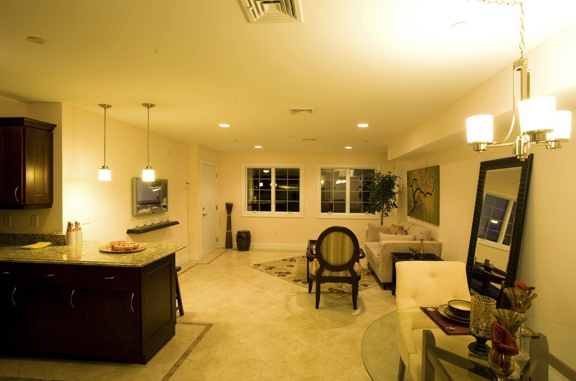A living room with a couch and a mirror