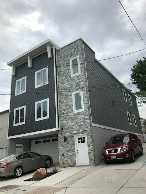 multistory grey condos building alternate angle