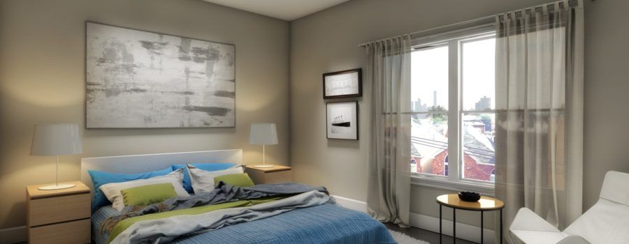 A bedroom with a bed , nightstand , table and window.