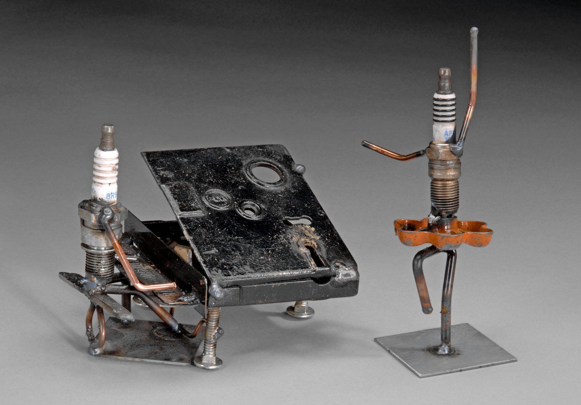 Sparkplug Sculpture of Piano Man and Dancer