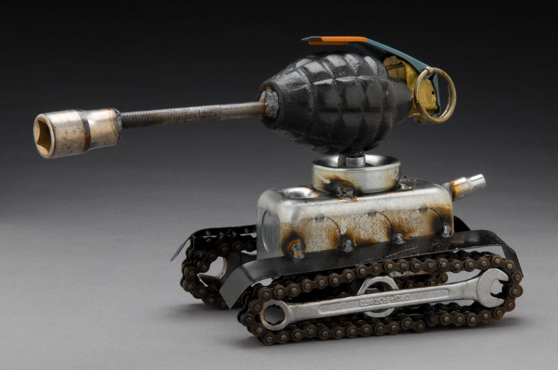Sparkplug Sculpture of Tank with Grenade
