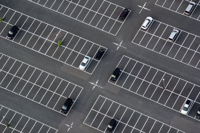 a huge parking lot with pavement markings