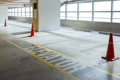 a parking space with orange cone road caution