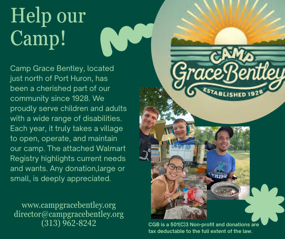 Two people seated at a patio table overlooking a lake. The person on the left smiles, and both are outdoors.