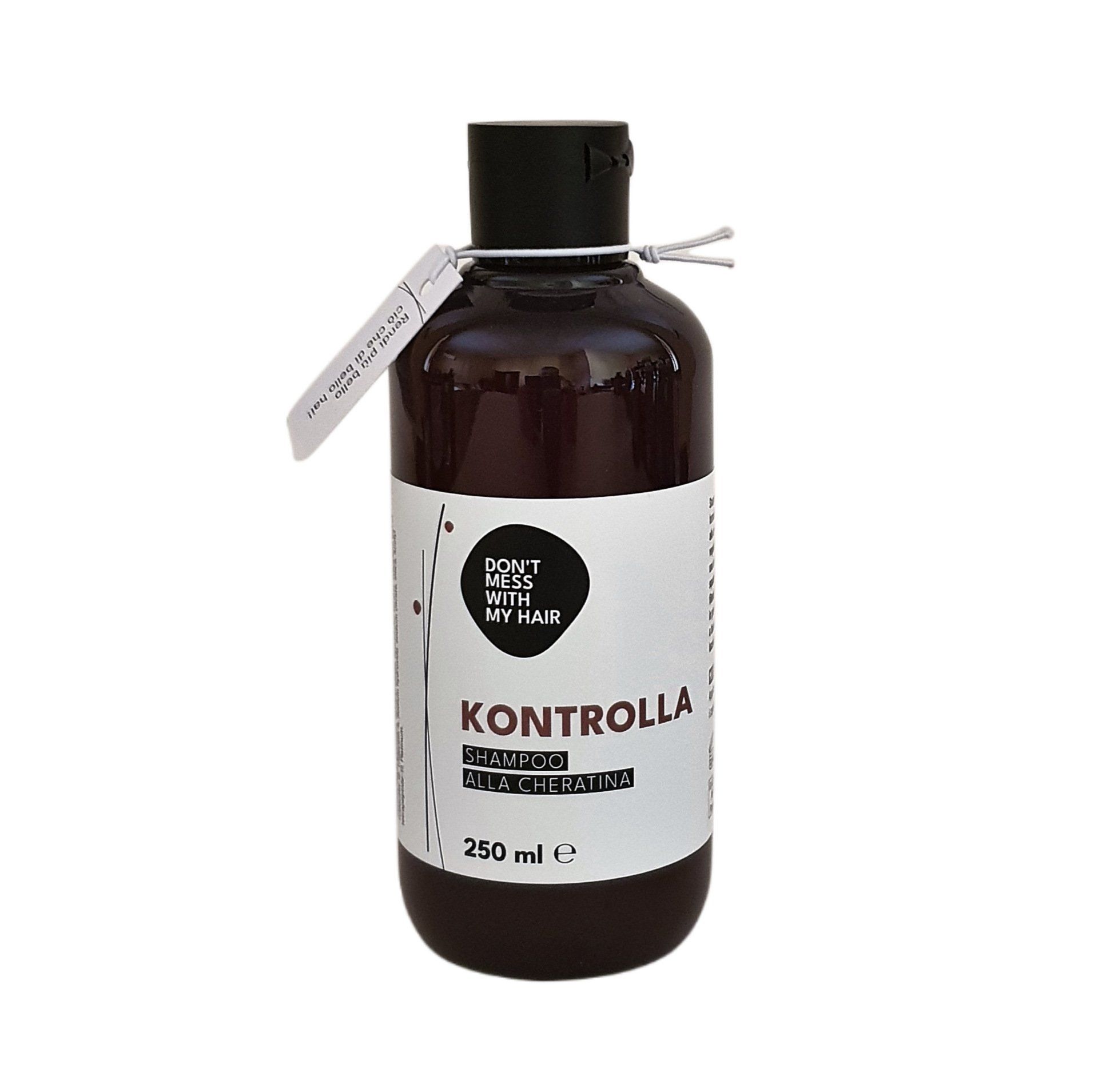 Flacone di liquido marrone scuro con tappo nero ed etichetta bianca. Sull'etichetta è scritto 