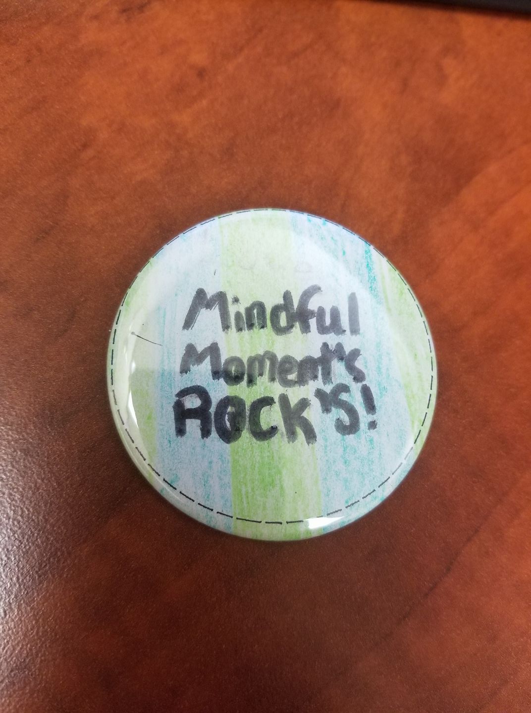 A button that says mindful moments rocks on it