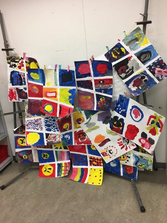 A bunch of colorful squares are hanging on a rack