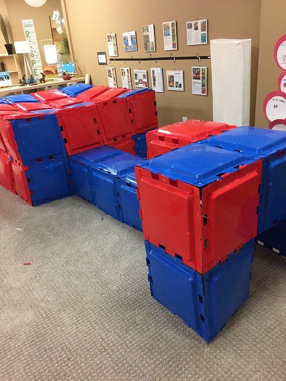 A room filled with red and blue plastic blocks