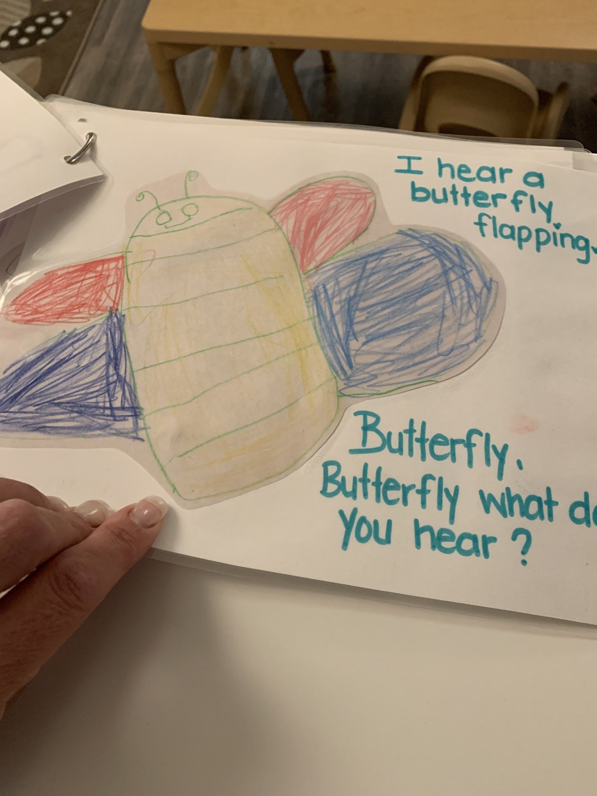 A child 's drawing of a butterfly that says 