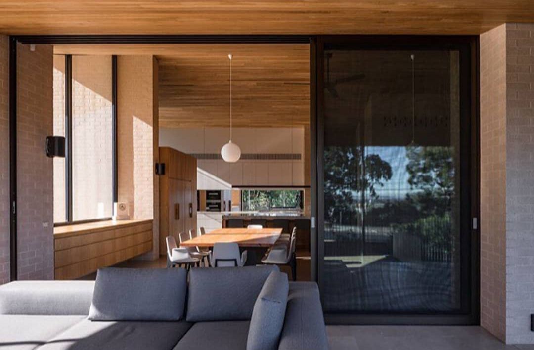 Modern Living Room With a Couch and a Sliding Glass Door — Morwell, VIC — Gippsland Windows