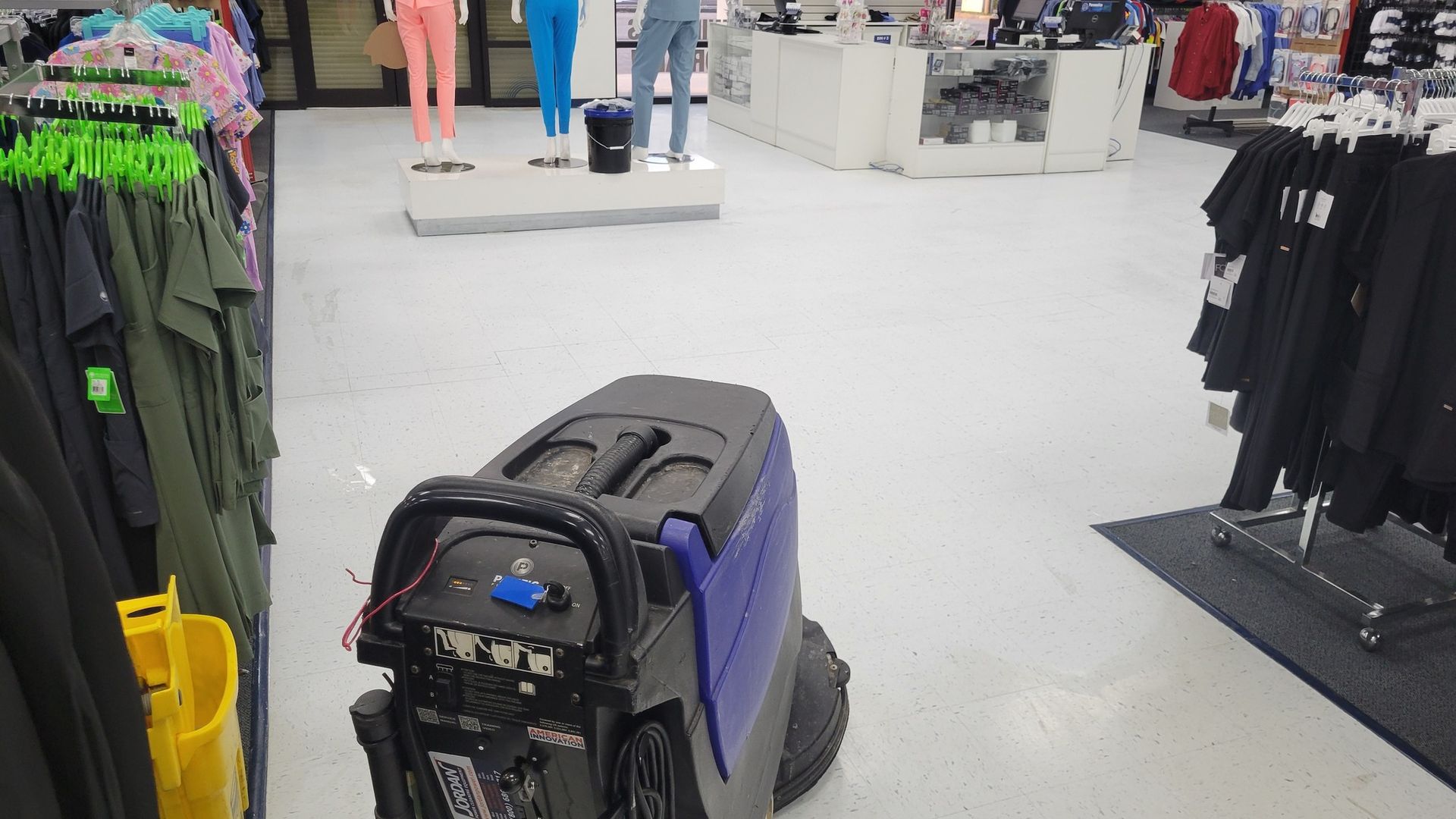 Outdoor patio with tables and chairs under string lights at night. Food trucks are visible in the background.