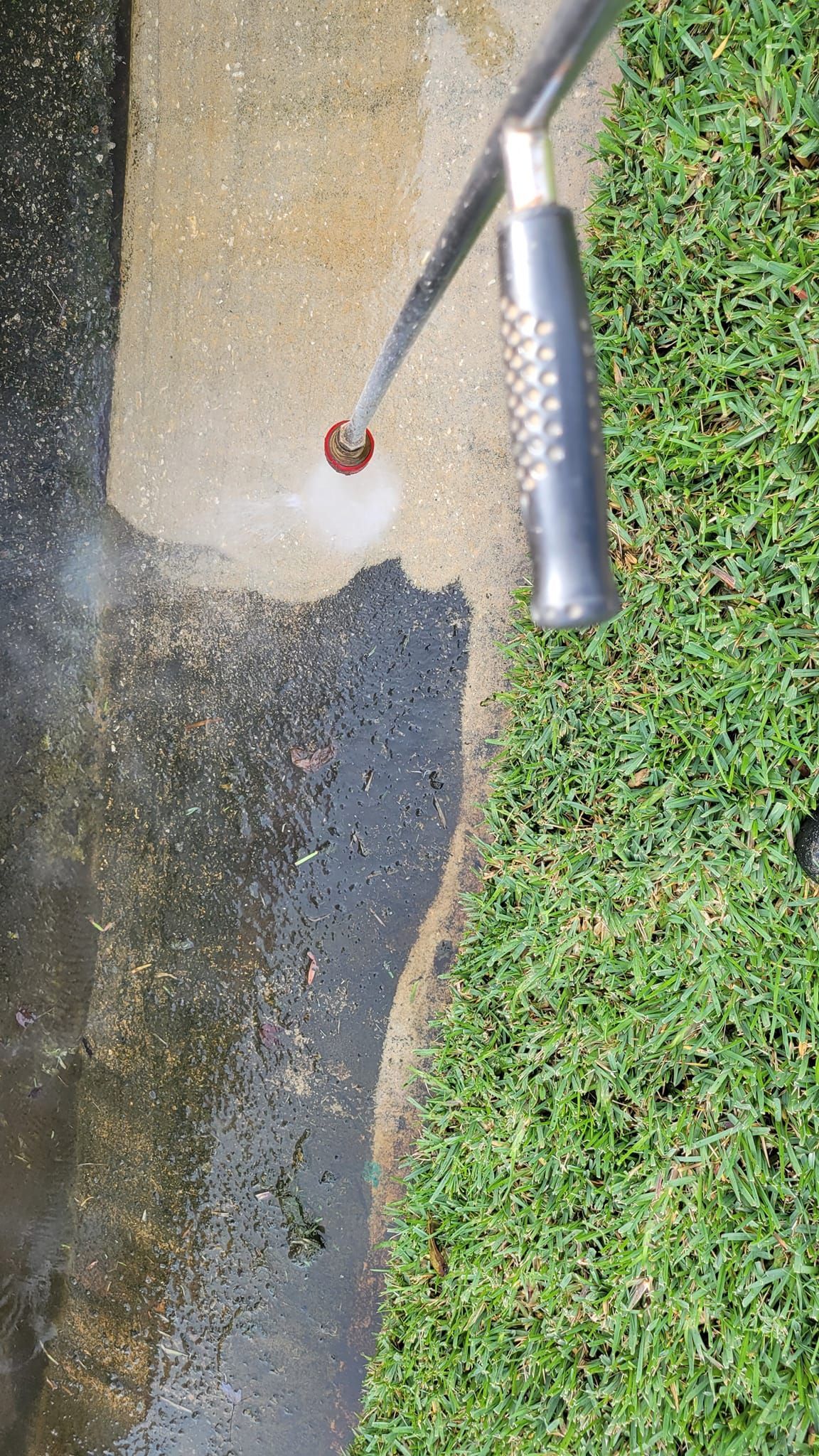 Outdoor patio with tables and chairs under string lights at night. Food trucks are visible in the background.