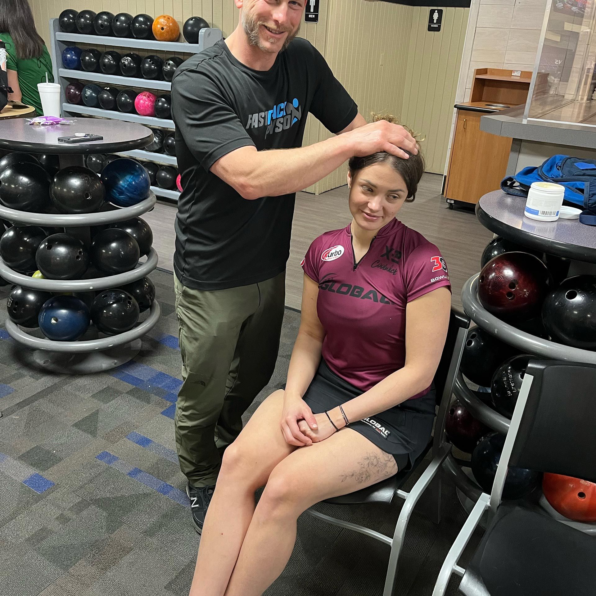 A Man Adjusts A Woman 's Hair - Chicago, IL - Fast Track Physio