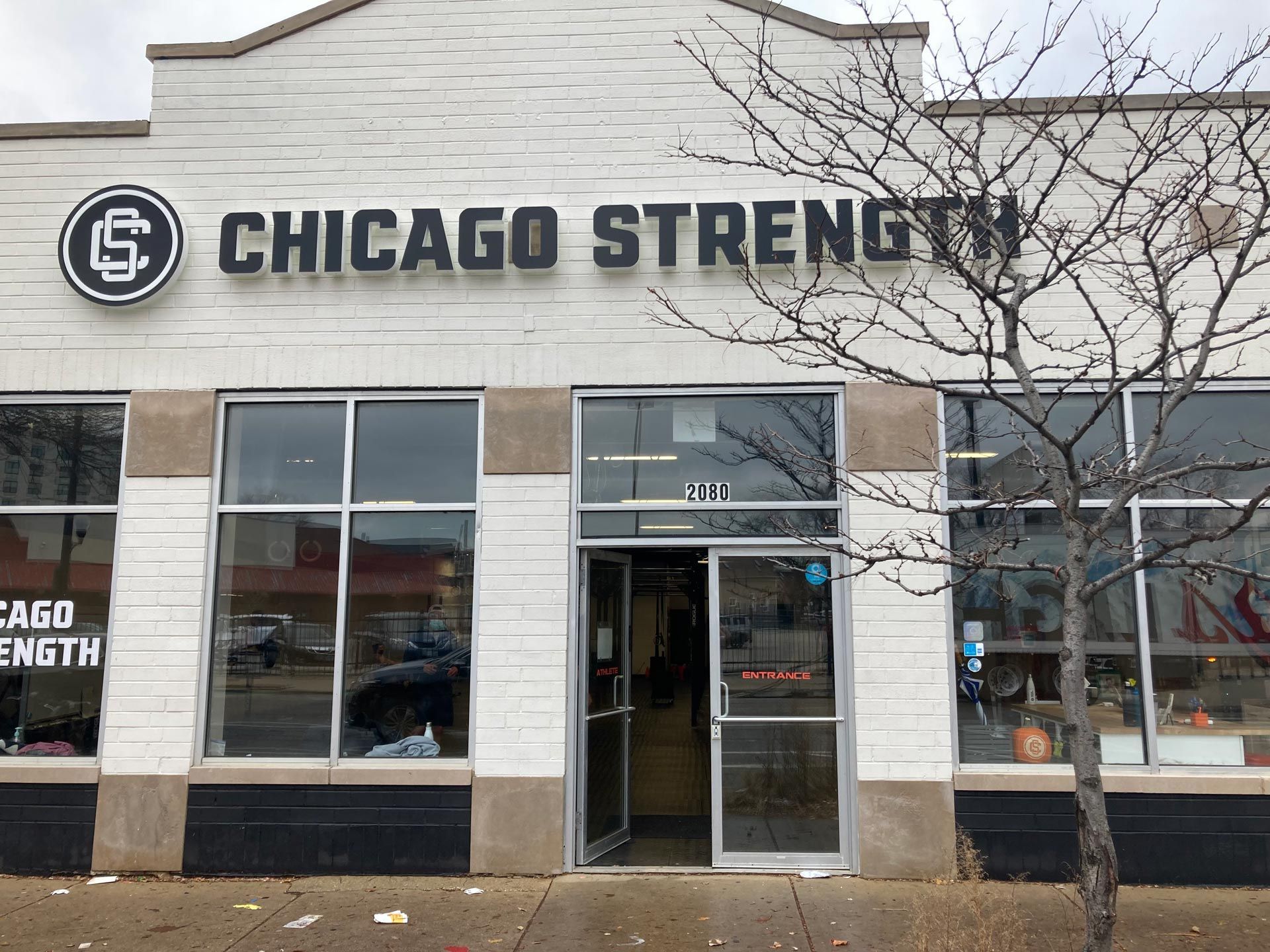A White Building With A Sign - Chicago, IL - Fast Track Physio