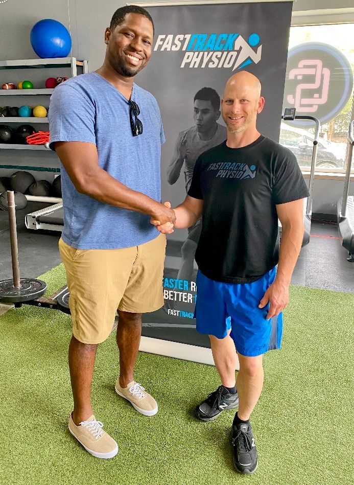 People In The Gym Shaking Hands - Chicago, IL - Fast Track Physio