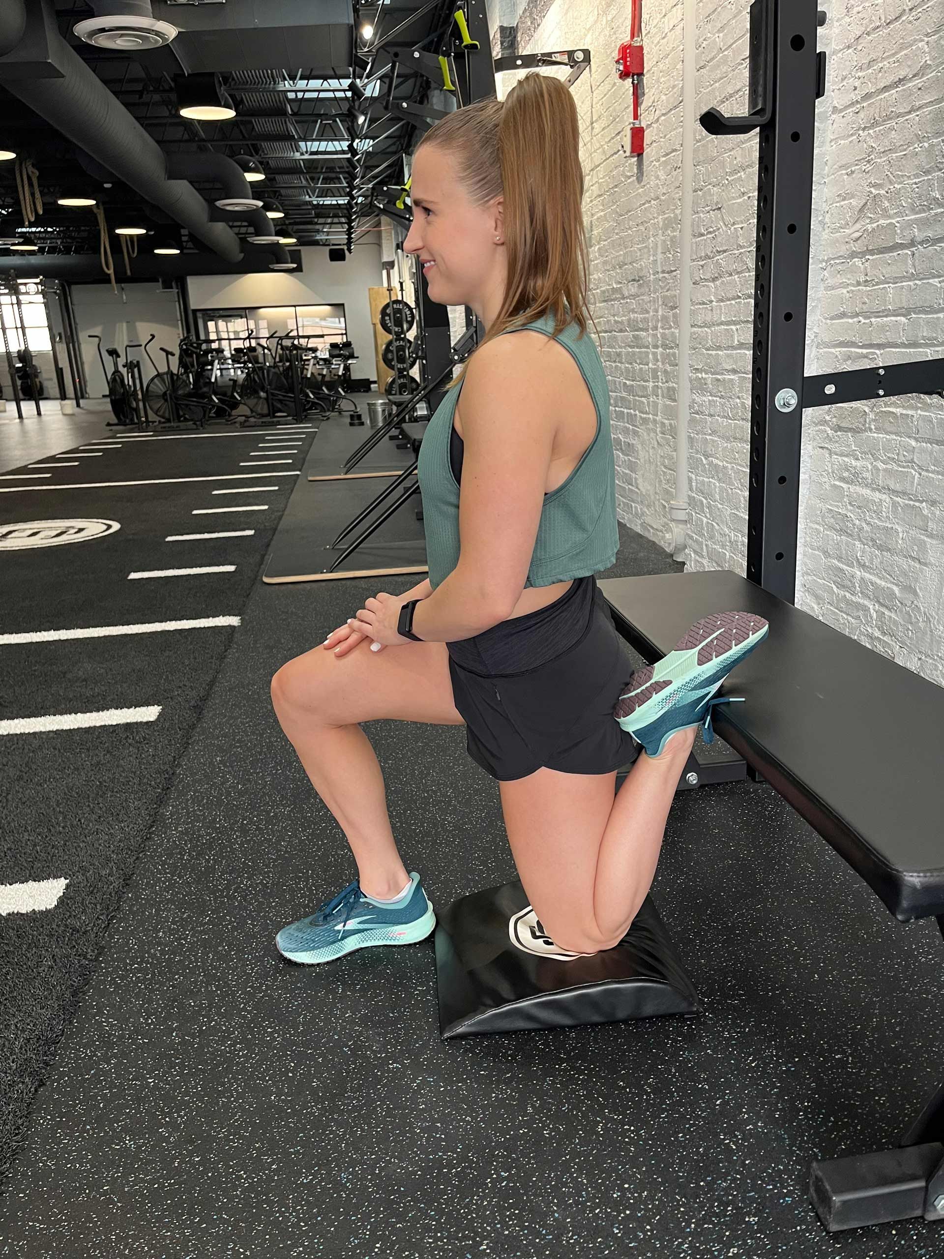 A Woman Squatting On A Bench - Chicago, IL - Fast Track Physio