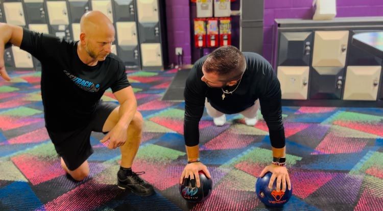 A Man Doing Push Ups With A Ball - Chicago, IL - Fast Track Physio
