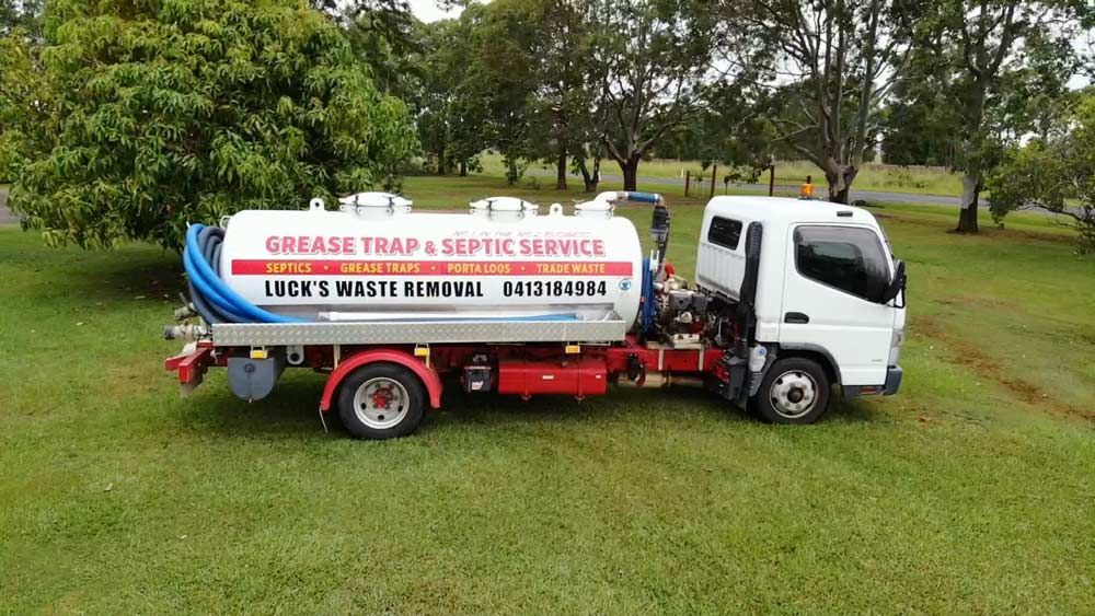 White Waste Disposal Vehicle — Waste Removal in Casino, NSW