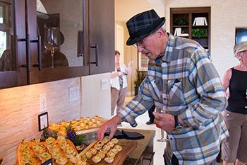 Man Looking at Appetizers at Event | Ryder Homes