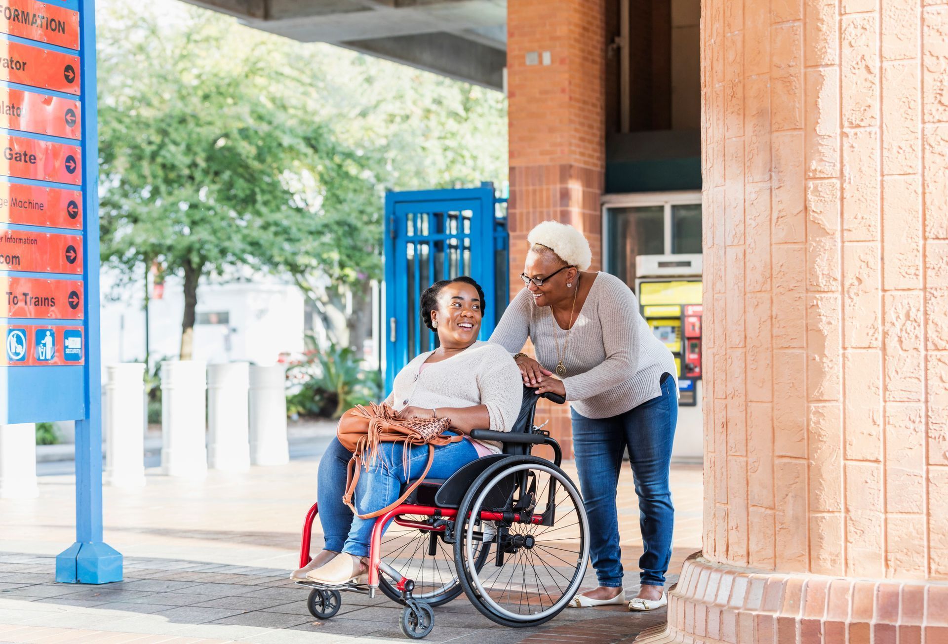 Assisting Elderly Woman on Wheelchair