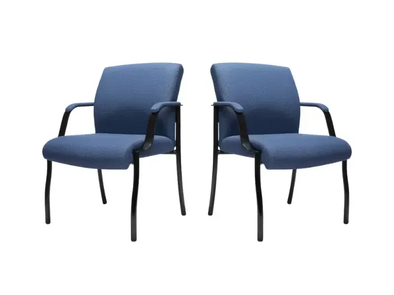 Two blue upholstered chairs with black metal frames.
