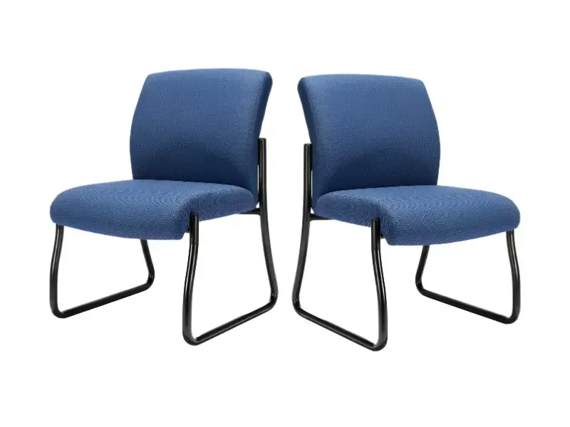 Two blue upholstered chairs with black metal frames.