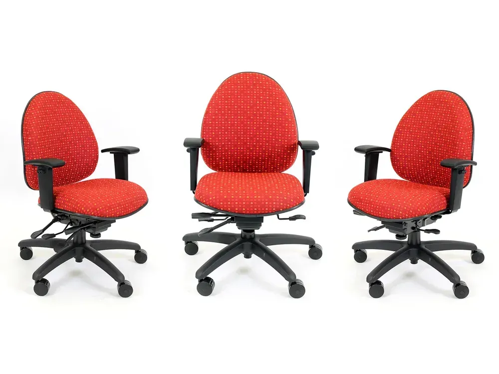 Three red office chairs with black bases, arms, and backs on a white background.