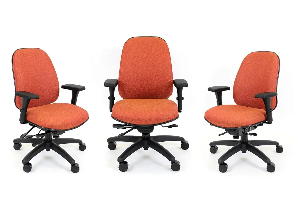 Three orange and black office chairs on a white background.