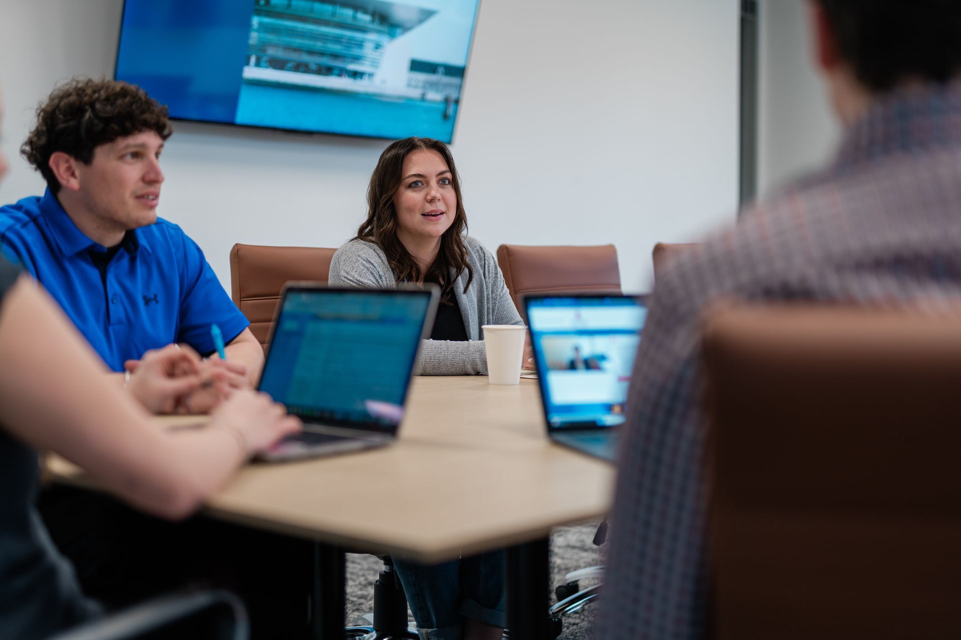 people meeting in a work room