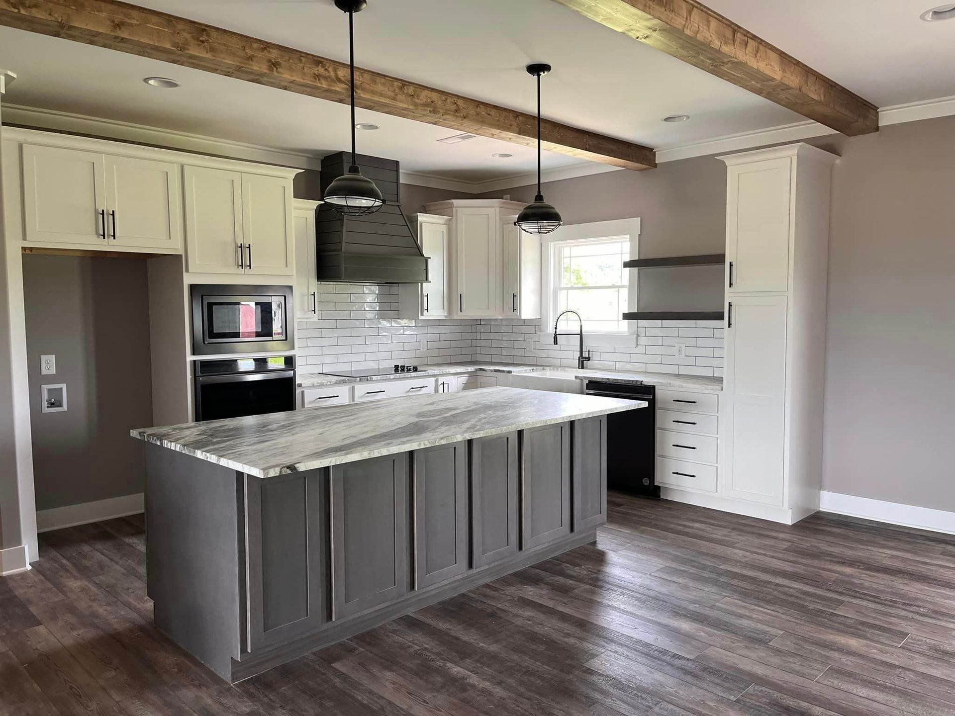 A kitchen with a large island in the middle of the room.