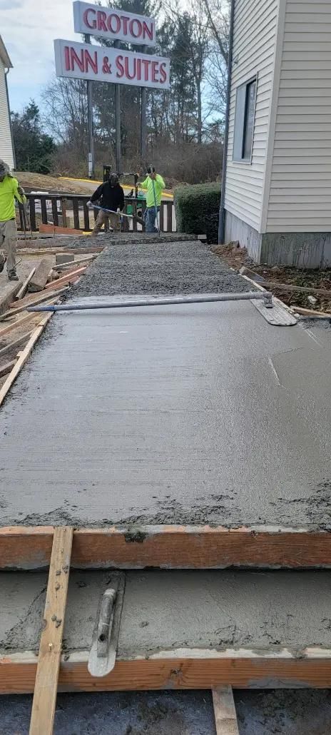 Freshly poured concrete walkway at Groton Inn & Suites. 