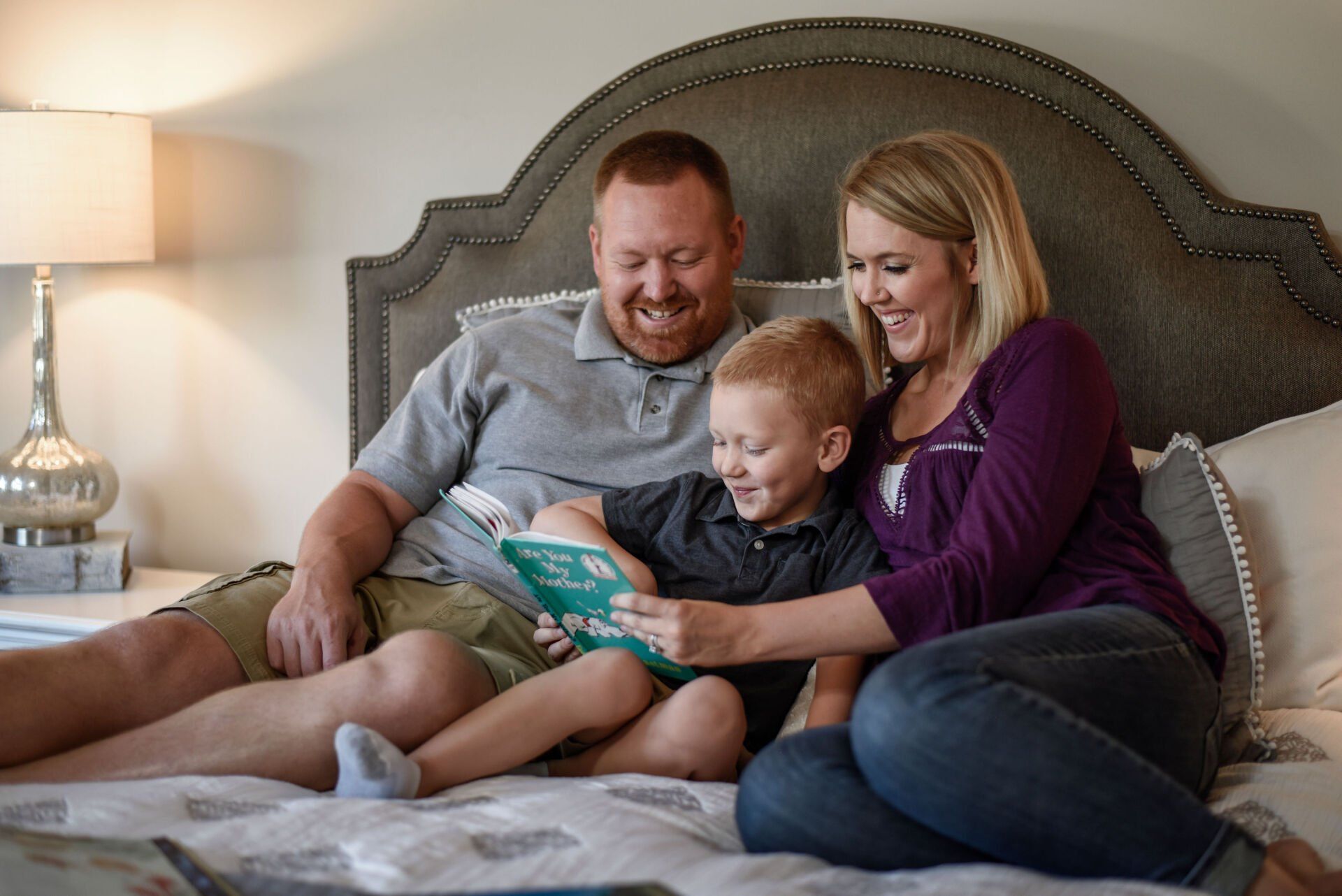 Family Reading On Bed