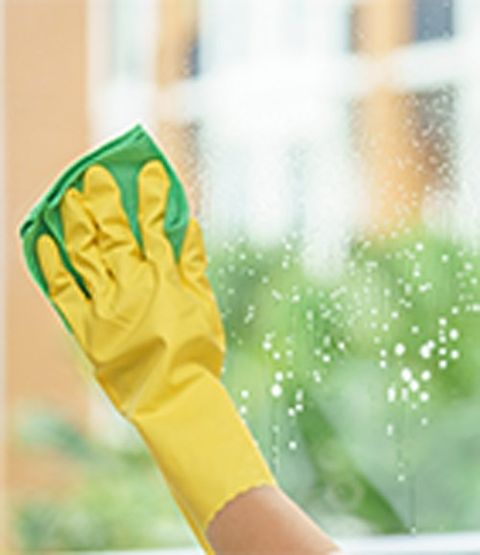 Cleaning Consultations — Cleaning Glass Window By Woman Hand in Redmond, WA