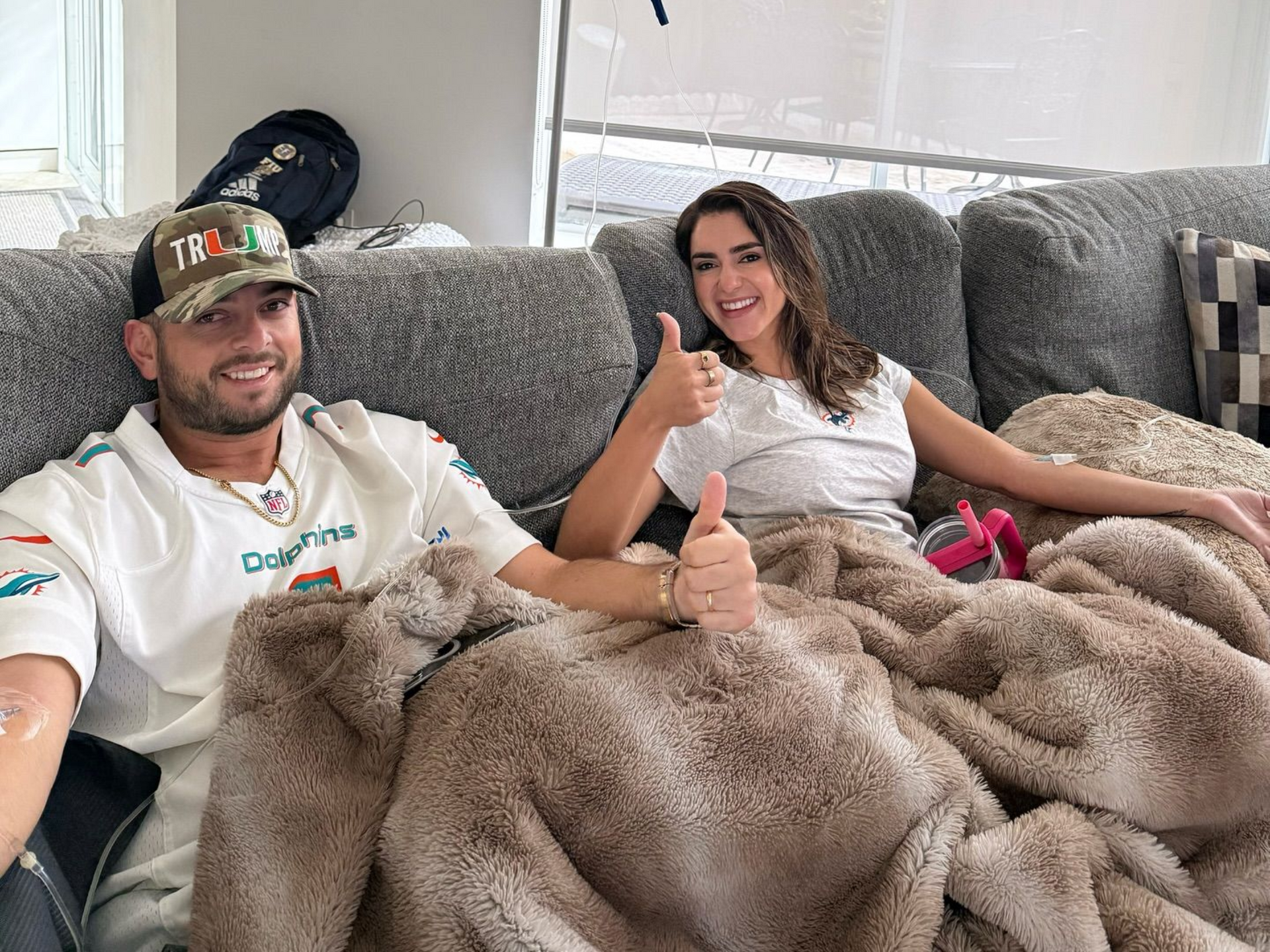 Four brown medicine bottles with different colored caps, one with a blue dropper inserted.