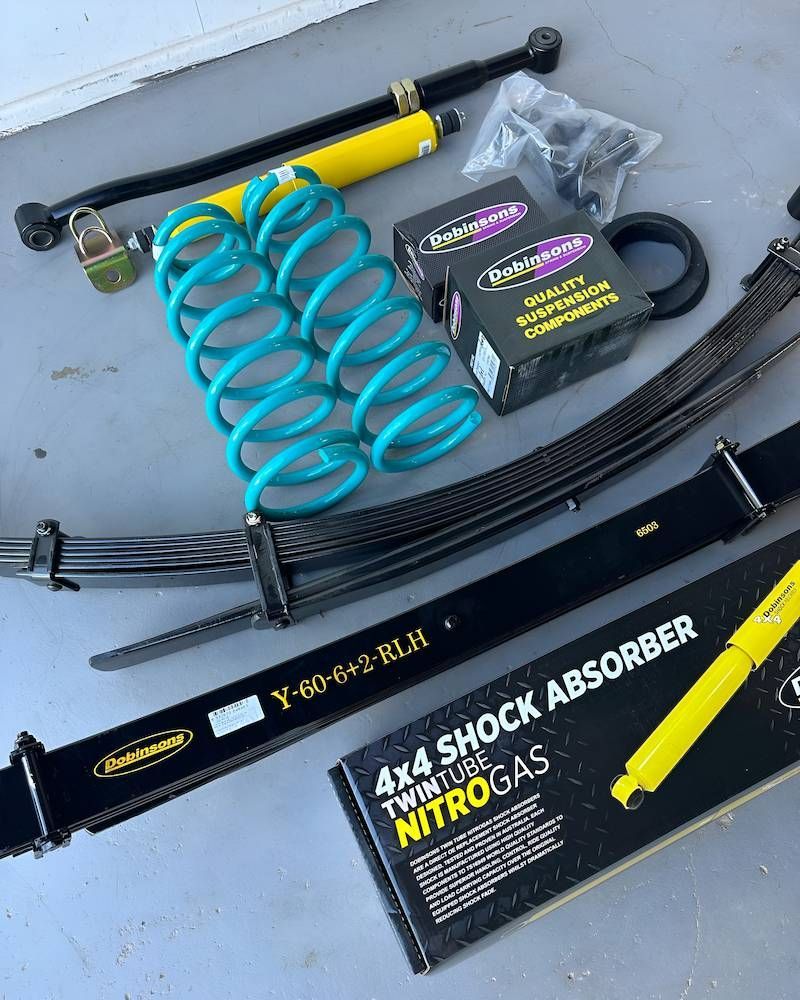 A Box of 4x4 Shock Absorbers is Sitting on a Table — RNA Mechanical In Yandina, QLD
