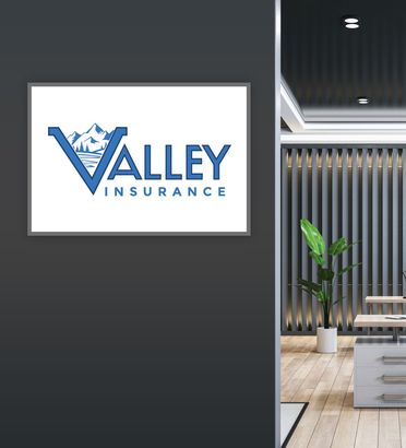 Logo on wall: Valley Insurance, blue logo with mountains, water and ‘V’ shape, with office interior.