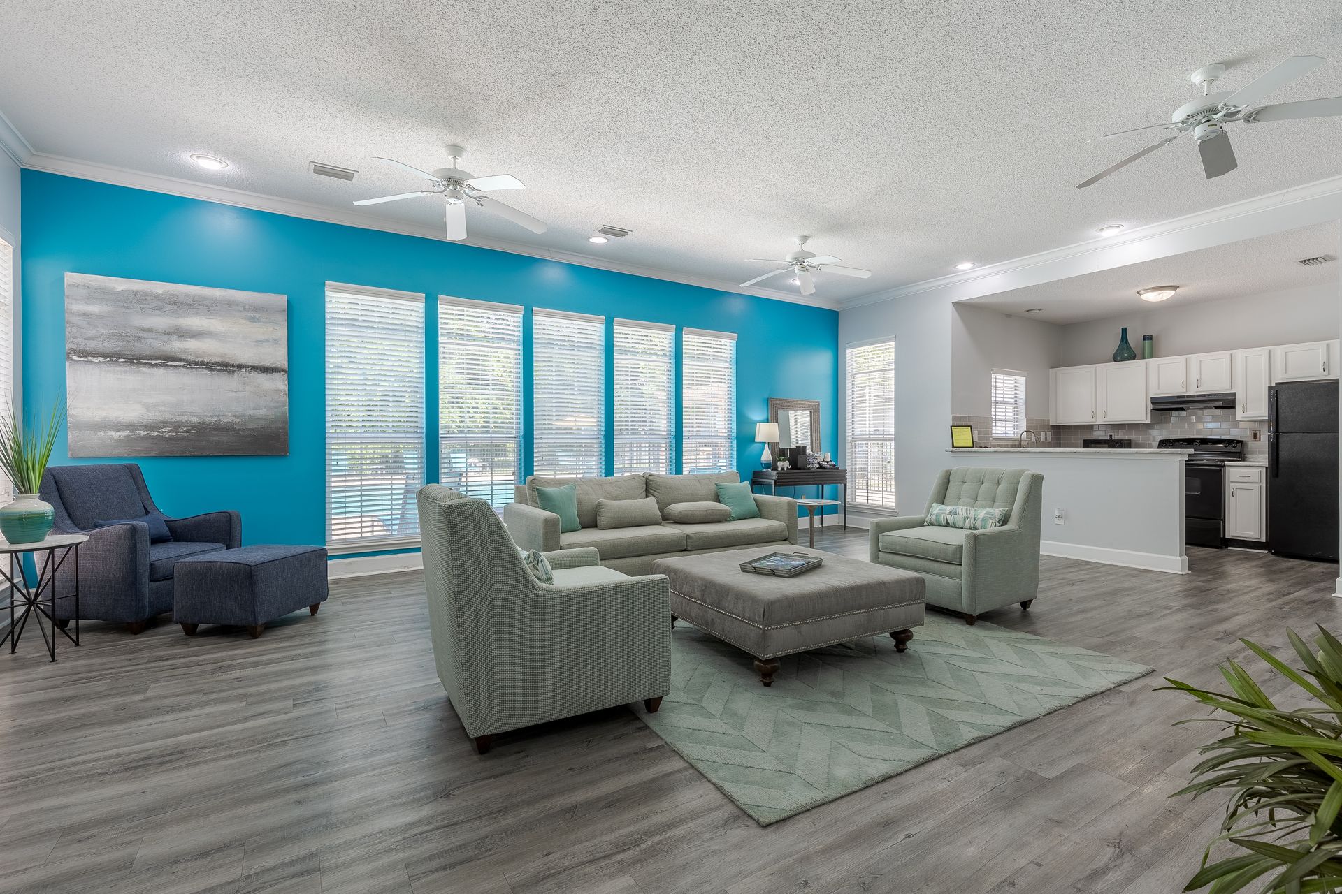 Outdoor grilling area with two grills, seating, and a yellow umbrella.