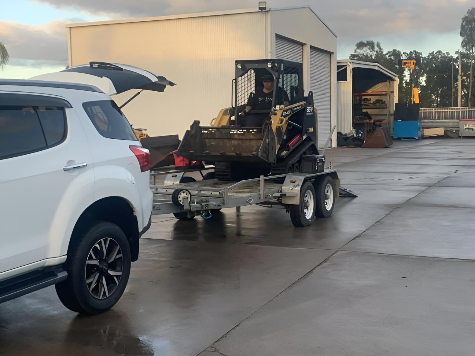 A White Suv Is Towing a Trailer — R&J Cronin Equipment Hire in Bonnells Bay, NSW