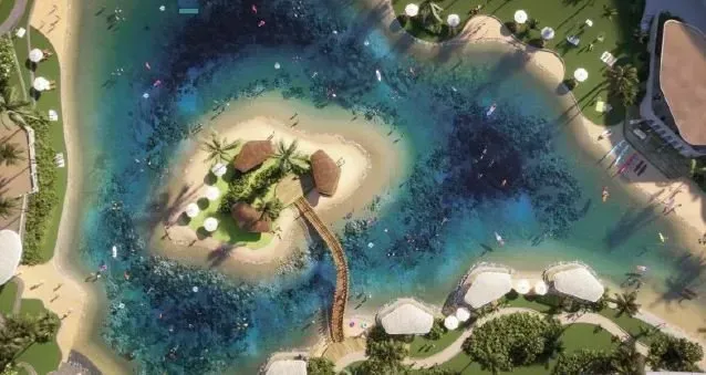 Aerial view of a lagoon with an island, bridge, beach, and people swimming and sunbathing.