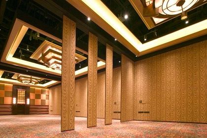 A large room with wooden walls and a ceiling