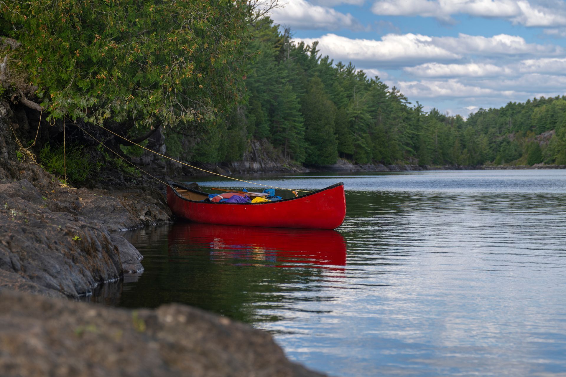 A woman is riding a tube in a swimming pool.