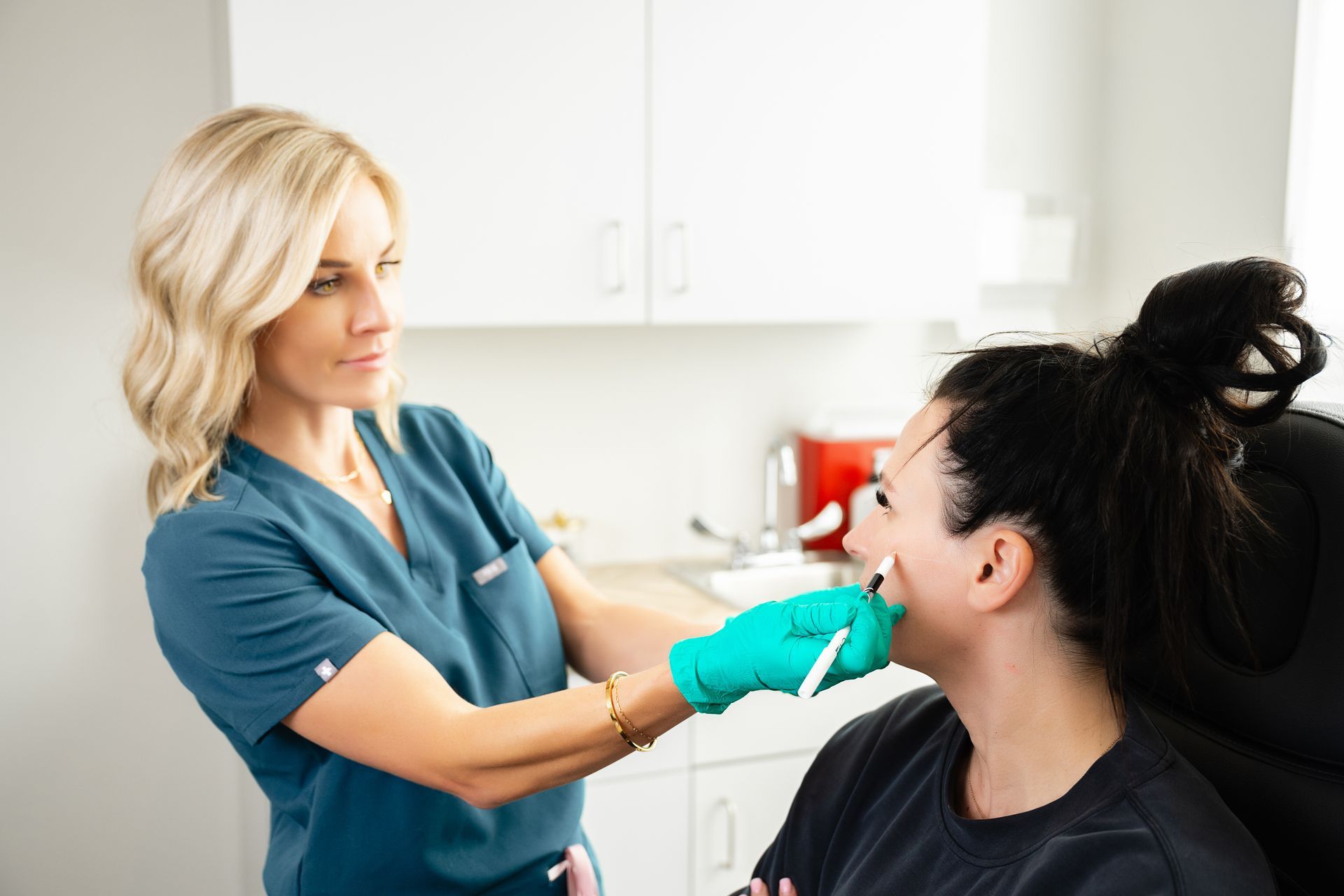 a woman getting cosmetic injection consultation